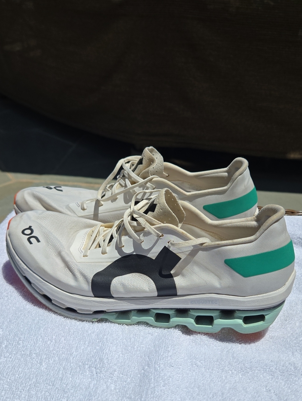 On Running Men’s White Sneakers with Black Logo and Teal Accents